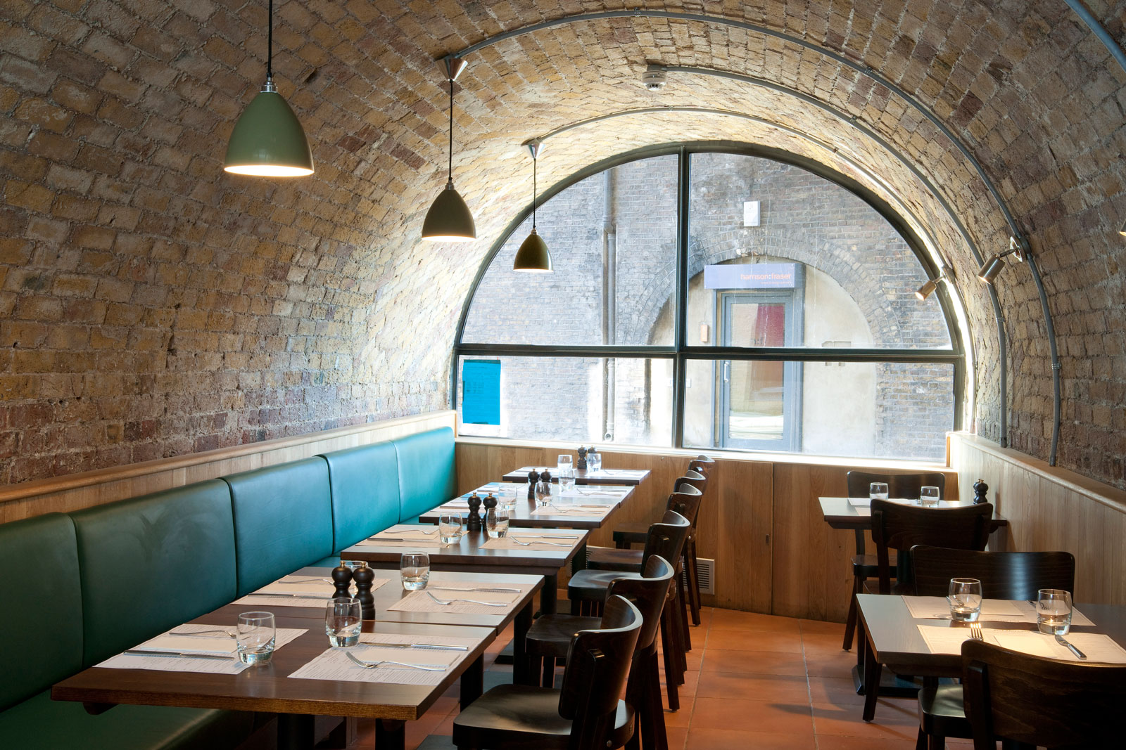 View of tables under arch of restaurant