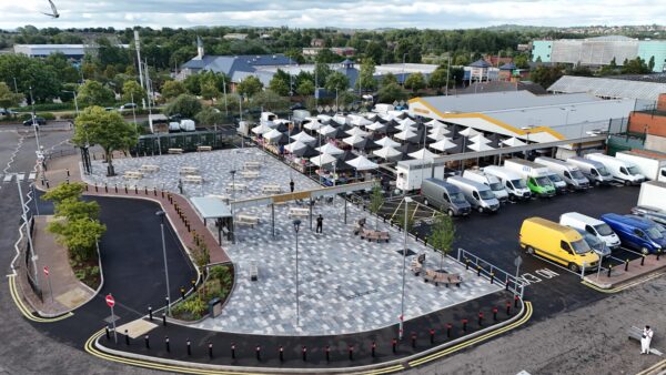 Aerial view of Bilston Market Square with the paved plaza and rows of market stalls leading to the Bilston Market building